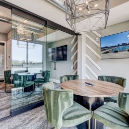 conference room with seating table and tv