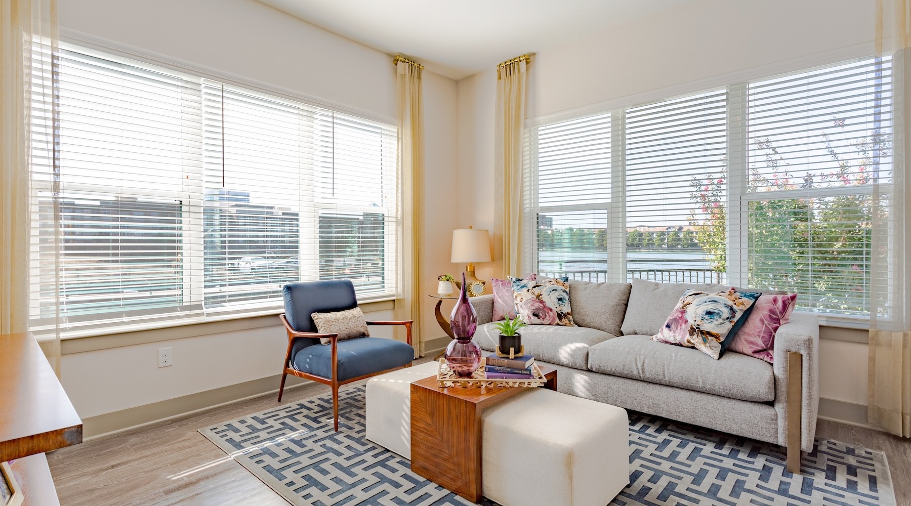 a living room with a couch and chairs