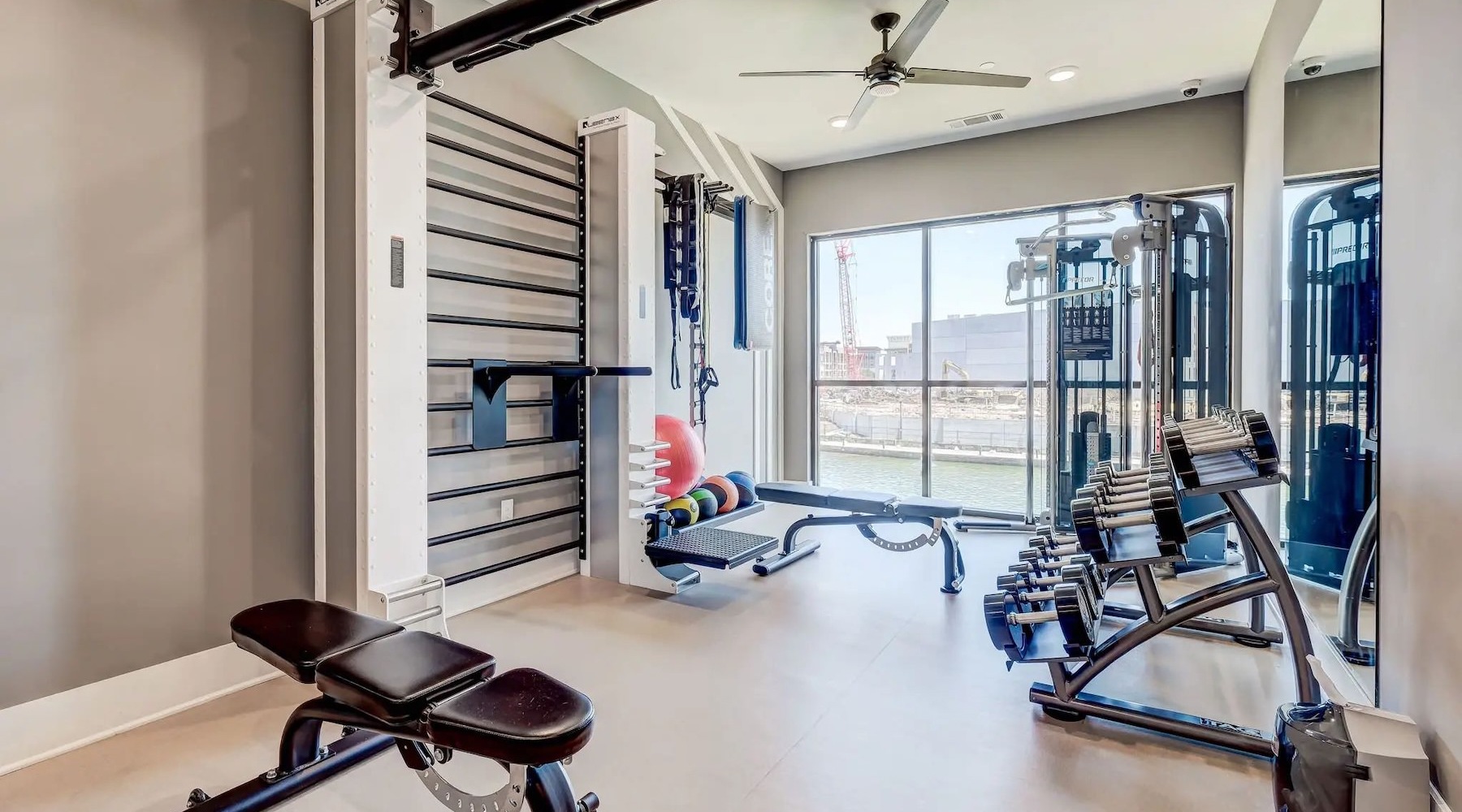 a room with a chair and a table with a gun in it