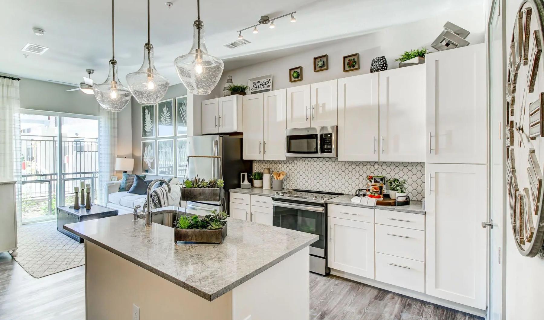 a kitchen with white cabinets