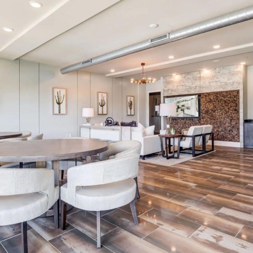 a large room with a table and chairs